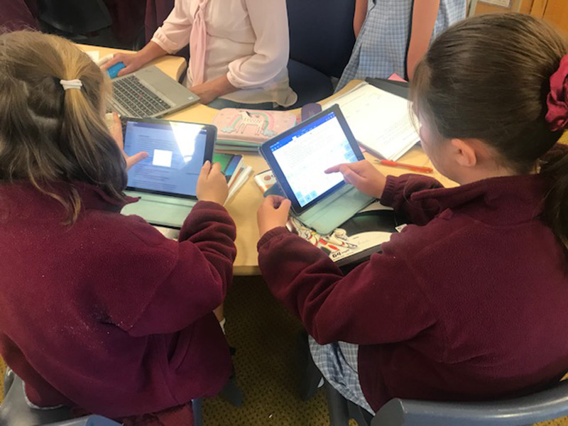 Children using computer tablets